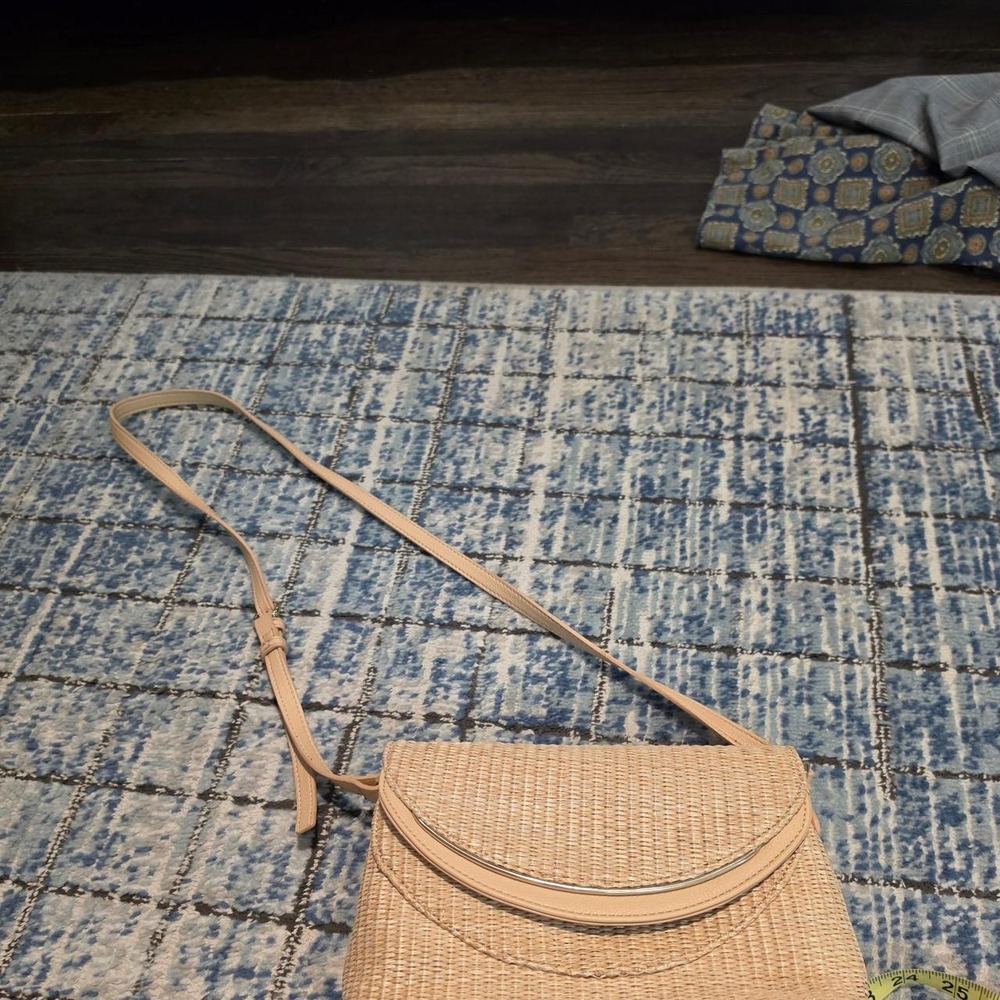 Tan woven straw crossbody bag